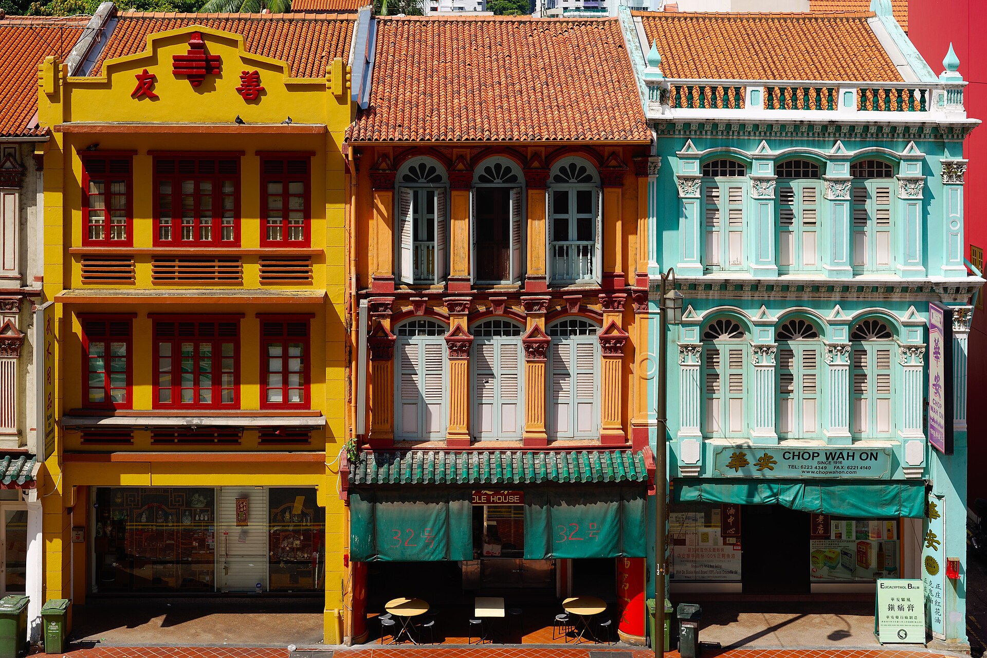hero best-restaurants-chinatown Heritage shophouse restaurants lining a street in Chinatown Singapore at dusk