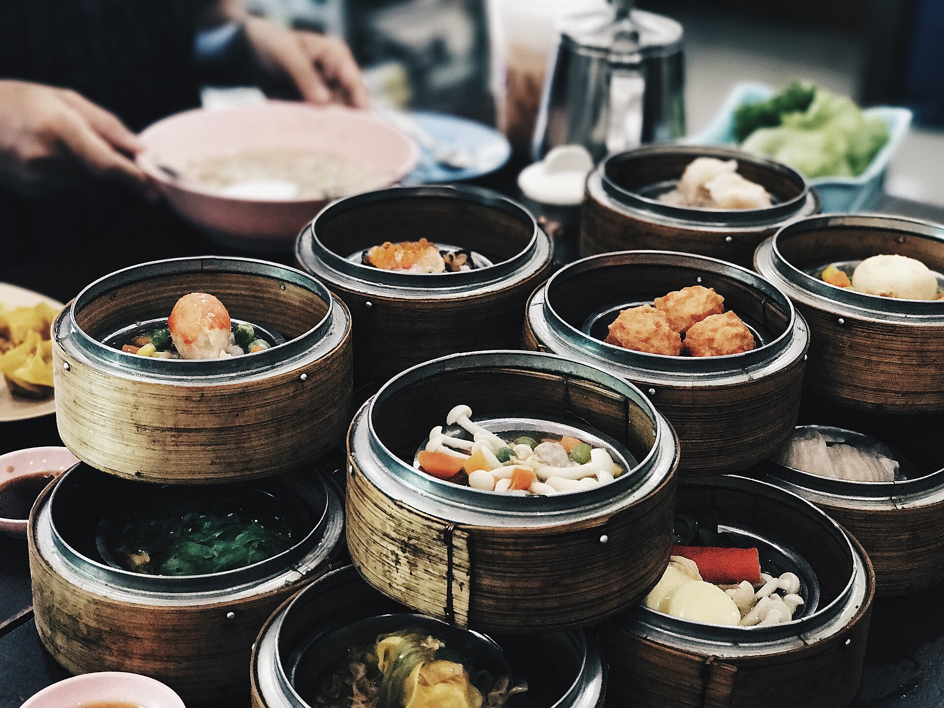 Bamboo steamers of dim sum including har gow and siu mai at a Chinatown restaurant